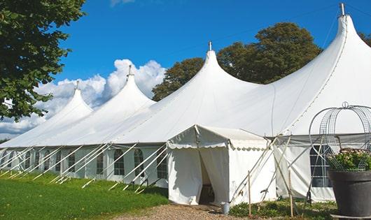 a line of sleek and modern portable toilets ready for use at an upscale corporate event in Hopewell